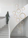 Asymmetrical Bola Halo LED Staircase Chandelier in Black/Gold for Split Level Entryway