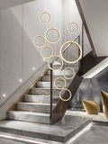 Asymmetrical Bola Halo LED Staircase Chandelier in Black/Gold for Split Level Entryway