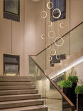 Asymmetrical Bola Halo LED Staircase Chandelier in Black/Gold for Split Level Entryway